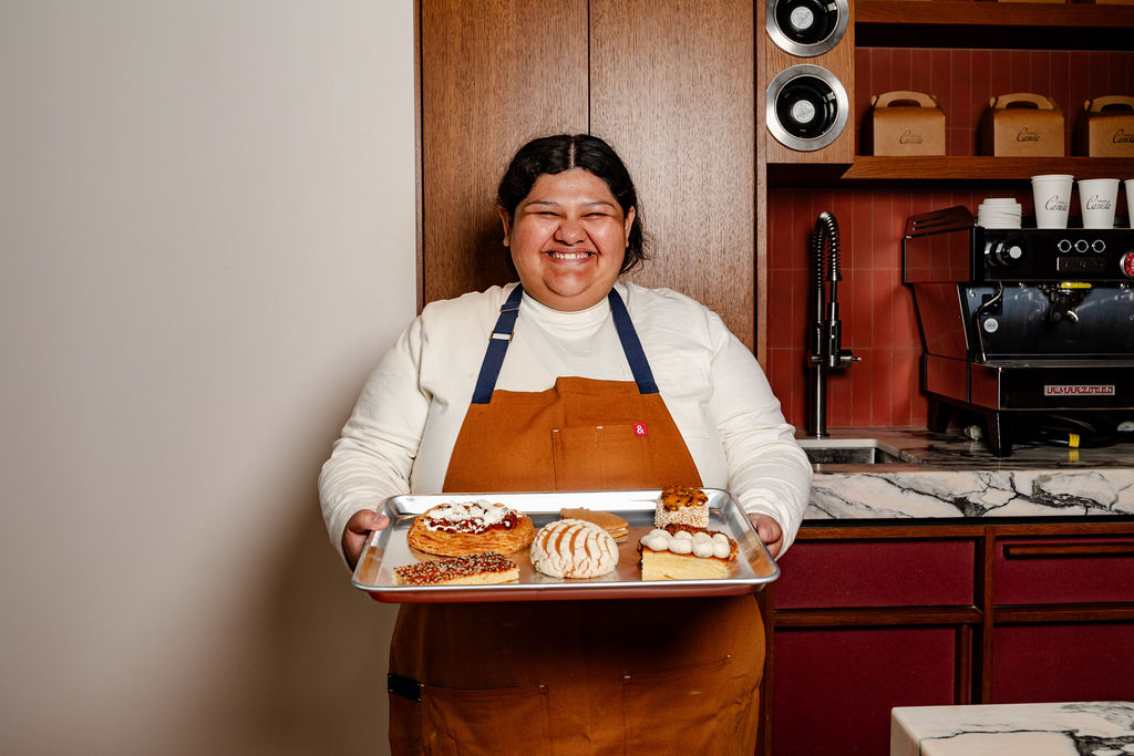 Ellen holding the morning tray of pan dulce