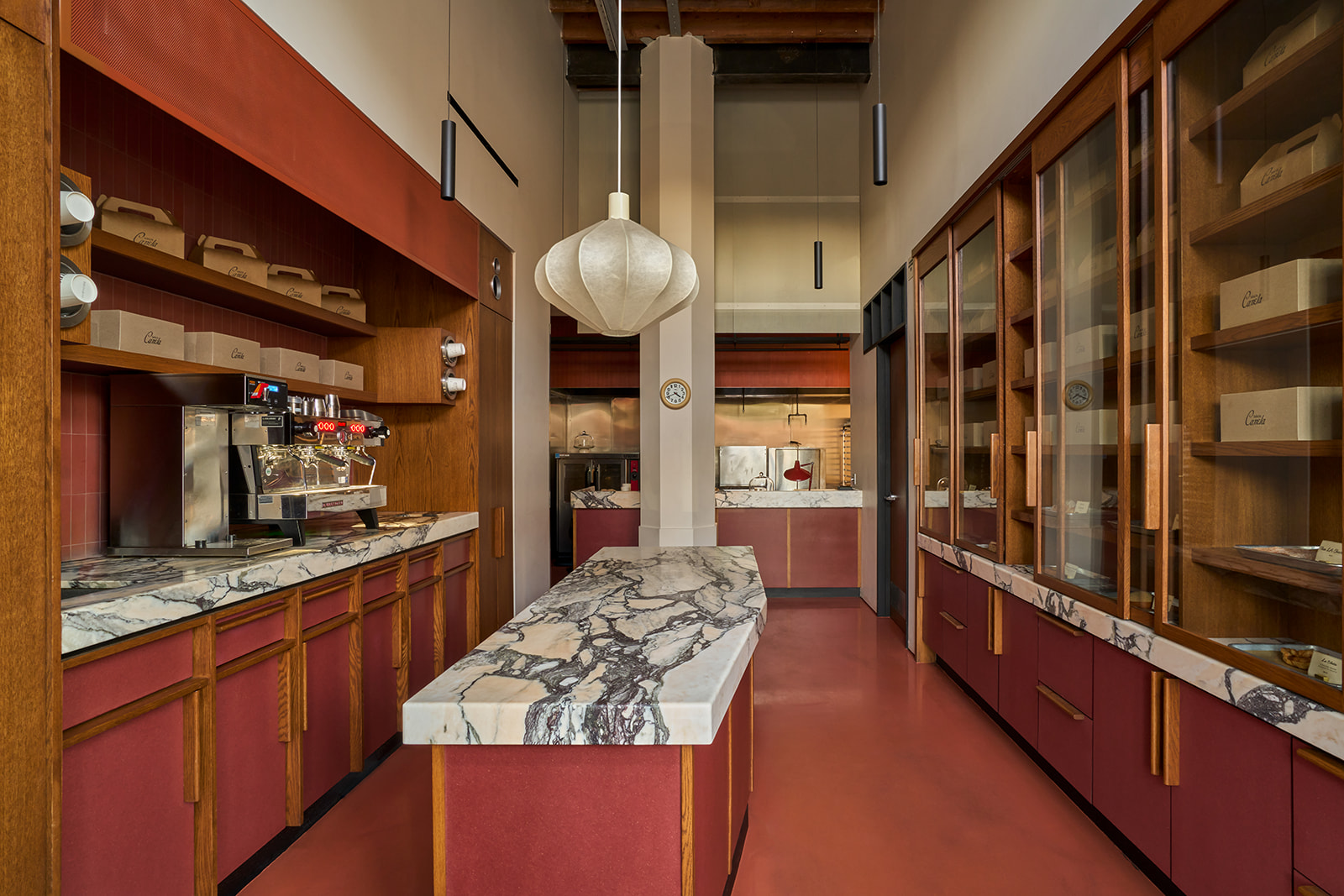 Inside the bakery: espresso bar, marble counter, and pastry cabinets