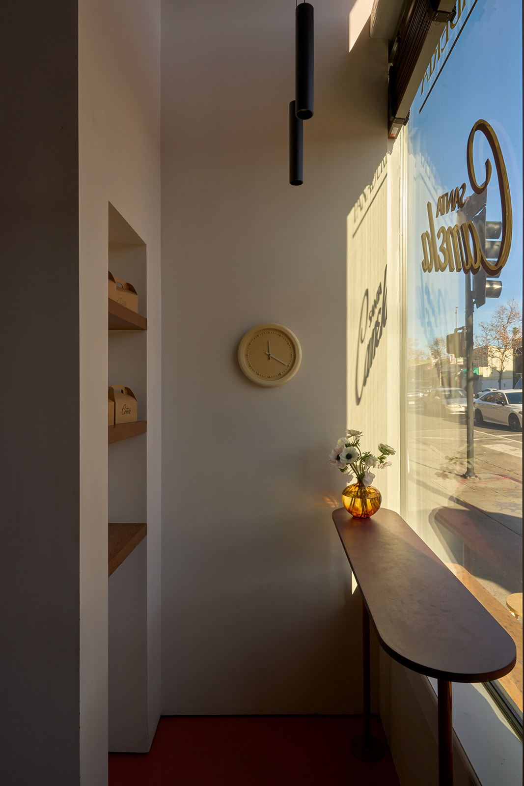 Morning light through the Santa Canela storefront on Figueroa